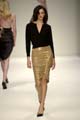 Cashmere cardigan with gold embroidered dragon	Gold suede leather skirt 