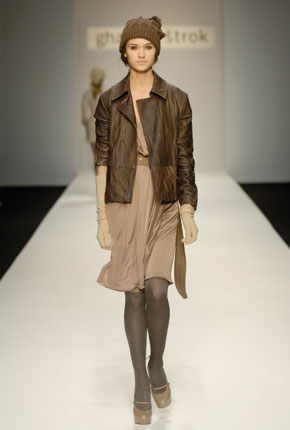 Gold fine liquid jersey pleated Grecian dress, brown leather biker jacket and tan nappa leather trench belt   