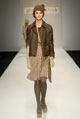 Gold fine liquid jersey pleated Grecian dress, brown leather biker jacket and tan nappa leather trench belt  