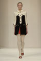Black chunky wool jacket, black nappa leather trench belt and black wool twill wool tulip skirt  